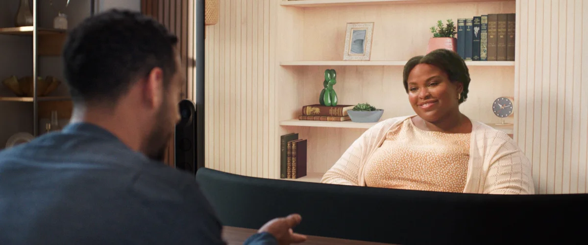 a picture of two people talking to each other remotely using Starline